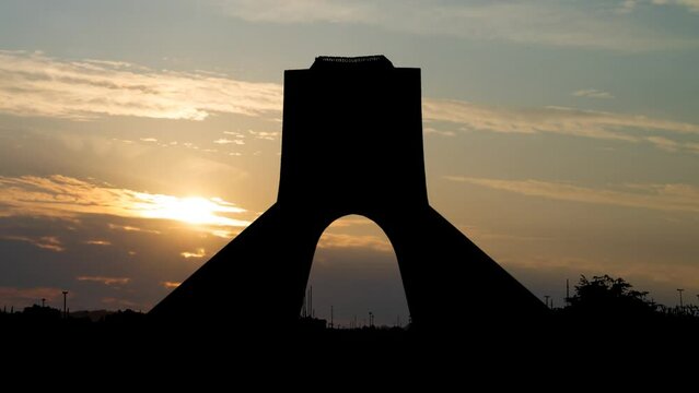 Azadi tower in Tehran, Time Lapse at Sunrise with Colorful Clouds, Iran