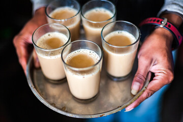 KATHMANDU, NEPAL: close-up of a chaï masala tray, spicy Indian milk tea