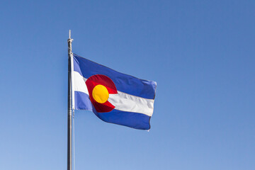 Flag of the State of Colorado against the blue sky