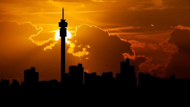 Johannesburg Skyline, Time Lapse at Sunset with Red Clouds and Fiery Sky, South Africa