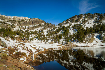 Chamrousse France 06 11 2022 winter hike around Lac Achard, pretty mountain lake located at 1917...