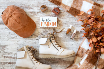 Cozy stylish women's fall fashion flat lay with boots and fleece jacket