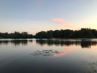 Fototapeta na wymiar Sunset over the lake in summer
