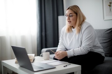 Woman with laptop studying