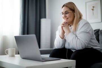 Student with laptop at home