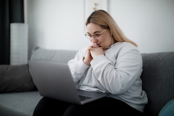 Student having online conversation on laptop