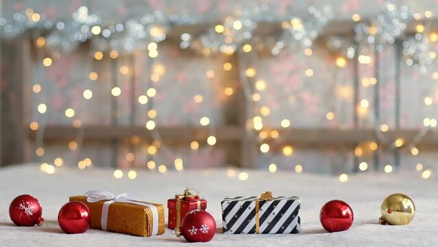 Gift box and Christmas decorations against the garland lights background. New Year and Christmas concept. Waiting for the holiday. 