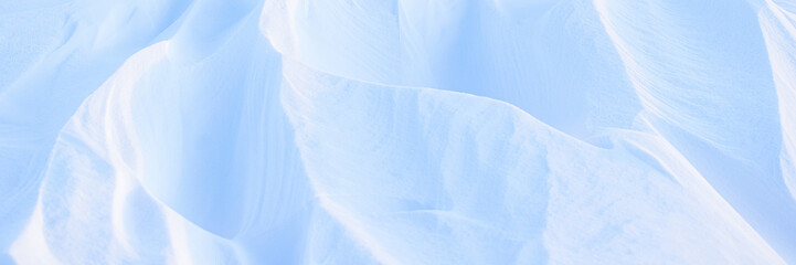 Snow texture. Wind sculpted patterns on snow surface. Wind in the tundra and in the mountains on...