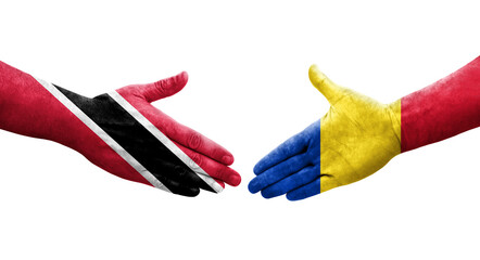 Handshake between Romania and Trinidad Tobago flags painted on hands, isolated transparent image.