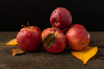 Red apples on a wooden table.