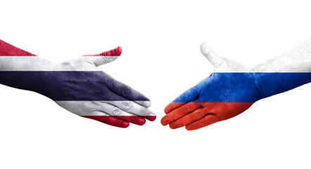 Handshake between Russia and Thailand flags painted on hands, isolated transparent image.