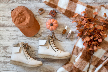 Stylish fall fashion accessories in warm pumpkin tones