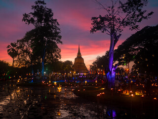 Beautiful scene of The light color Sukhothai Co Lamplighter Loy Kratong Festival at The Sukhothai Historical Park covers the ruins of Sukhothai Amazing Thailand.