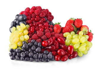 A variety of summer berries in the shape of heart as a symbol of valentine and love