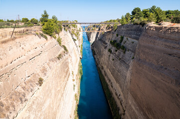 Photo of the very narrow Corinth Canal. The canal is connects the Gulf of Corinth in the Ionian Sea with the Saronic Gulf in the Aegean Sea.