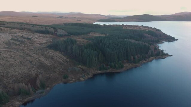 Aerial drone shot of still lake at Loch Doon, Galloway Forest Park
