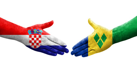 Handshake between Saint Vincent Grenadines and Croatia flags painted on hands, isolated transparent image.