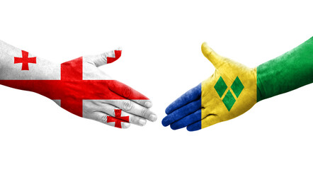 Handshake between Saint Vincent Grenadines and Georgia flags painted on hands, isolated transparent image.