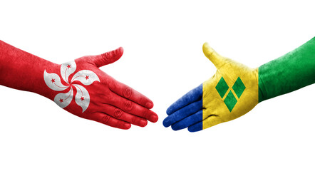 Handshake between Saint Vincent Grenadines and Hong Kong flags painted on hands, isolated transparent image.