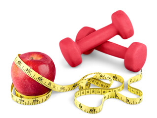 Dumbbells with measuring tape and apple isolated on white background
