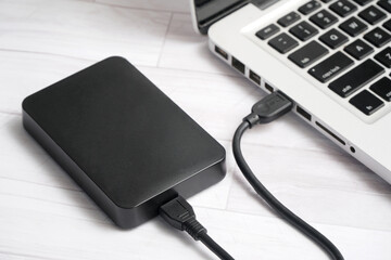 Black External hard drive connect with laptop with usb cable