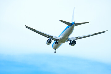 Naklejka premium Airplanes, passengers flying in the sky, preparing to land at the airport
