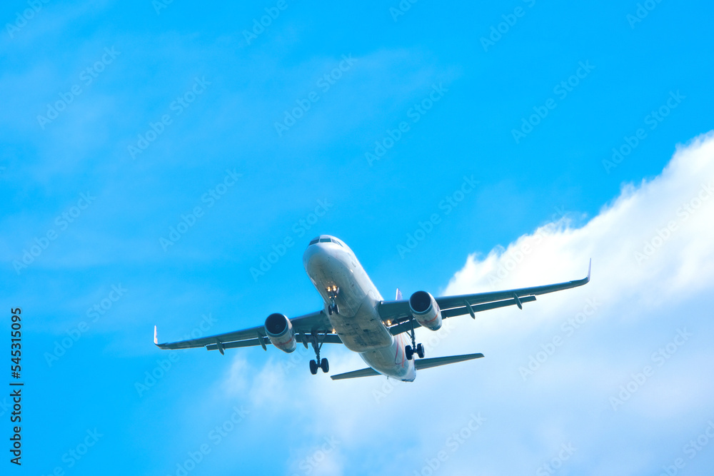 Wall mural airplanes, passengers flying in the sky, preparing to land at the airport