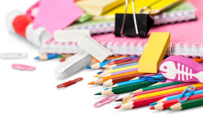 Colorful school supplies on  background
