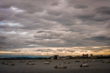 Many Boats anchored in Carson Beach Harbor in a cloudy day in Boston