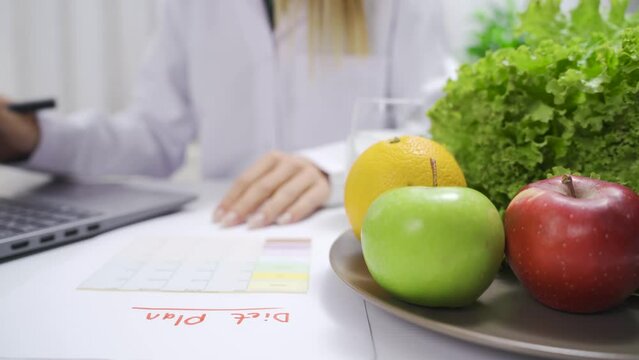 Staying healthy and dieting.
Dietitian woman prepares a vegetable-based diet plan.
