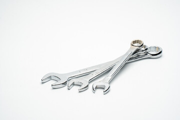 Three open wrenches on white background, general mechanic tool The material is made of chrome-plated silver steel. Used for maintenance of machines and car garages. Including repair work in the house