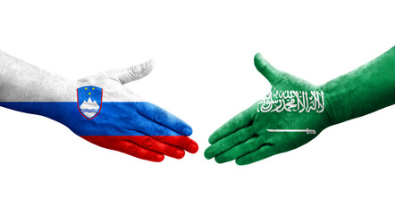 Handshake between Saudi Arabia and Slovenia flags painted on hands, isolated transparent image.