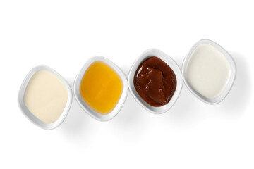 the various barbecue sauces in ceramic bowls