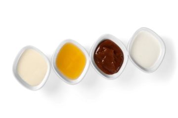 the various barbecue sauces in ceramic bowls