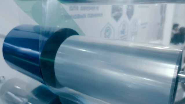 Rolls of film in different colors for packaging and safe transportation of items. Shot in motion. Closeup