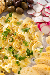 Butter board with vegetables and bread