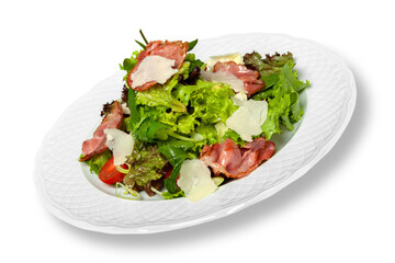Close-up of tasty fresh salad in white plate isolated on white background