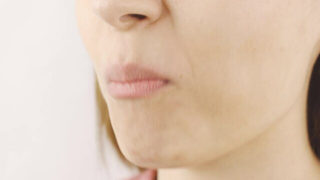 Woman eating dried pineapple in close-up. Dry fruits.
Close-up woman eats dried pineapple.
