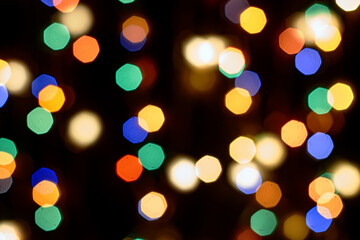 multicolored festive lights on a black background screensaver backdrop