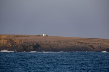Cliffs and rocky coastline silhouette coast of Shetland Islands in Atlantic Ocean on sunny day with...