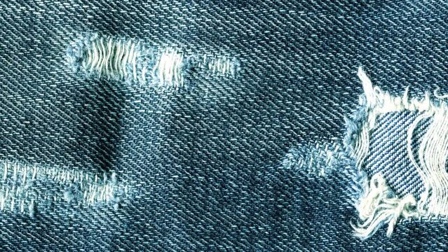 Texture Jeans stop motion video. 4k stock clip with fabric animation. A textile background with space for text.