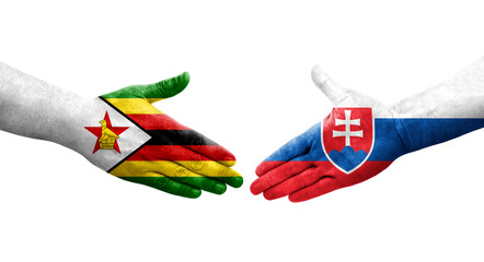 Handshake between Slovakia and Zimbabwe flags painted on hands, isolated transparent image.