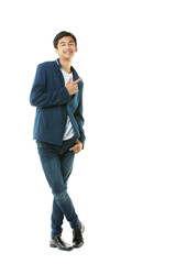 Asian early teenage boy in casual wear with braces is smiling self-assuredly, pointing his finger at isolate space on white background. - 545334894