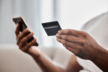 Online shopping, payment and hands with a credit card and phone for ecommerce, banking and easy...
