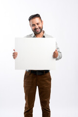 Indian man in formal wear and showing empty board