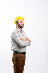 Young Indian engineer wearing yellow color hard hat and giving expression on white background.