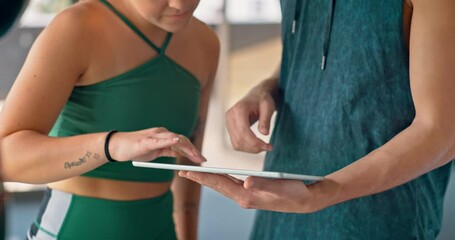 Fitness, gym and communication on tablet with personal trainer for exercise schedule, planning and goals. Health, wellness and professional workout coach consulting with woman client.