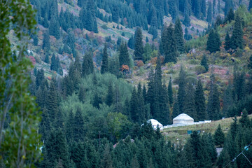 Kazakh guest yurt on the background of mountains not far from Almaty in early autumn. A beautiful...