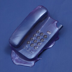 Creative minimalist layout. Retro phone with slime on blue background. Surreal summer idea. Conceptual pop