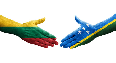 Handshake between Solomon Islands and Lithuania flags painted on hands, isolated transparent image. - obrazy, fototapety, plakaty